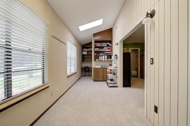 1810 Sandpiper Dr, Edmond, OK 73034 - office space featuring a skylight, light colored carpet, and vaulted ceiling