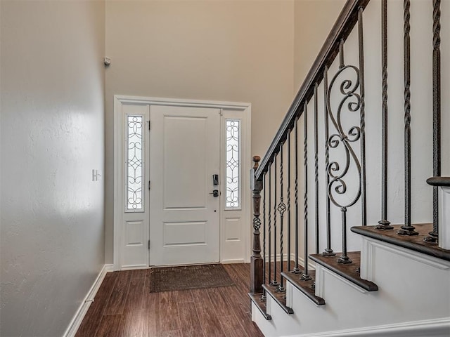 3939 S Santa Fe Ave, Norman, OK 73072 - entryway with dark wood-style floors, a towering ceiling, and stairway