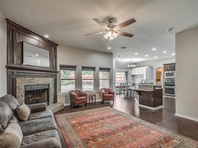 3939 S Santa Fe Ave, Norman, OK 73072 - living room with dark wood-style flooring, a chandelier, ceiling fan, a high end fireplace, and recessed lighting
