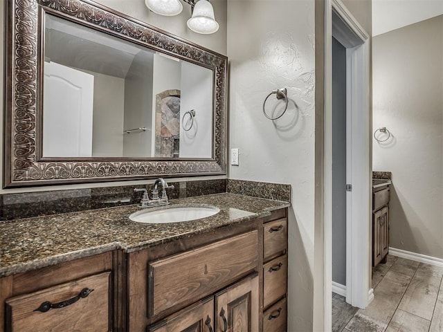 3939 S Santa Fe Ave, Norman, OK 73072 - bathroom featuring vanity and wood finished floors