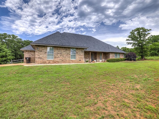 940908 S 3300th Rd, Luther, OK 73054 - back of house featuring brick siding and roof with shingles