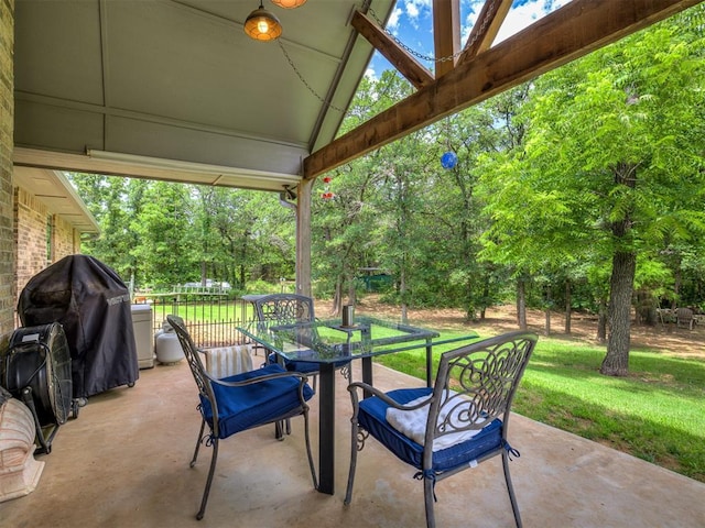940908 S 3300th Rd, Luther, OK 73054 - view of patio featuring view of scattered trees, outdoor dining space, and area for grilling