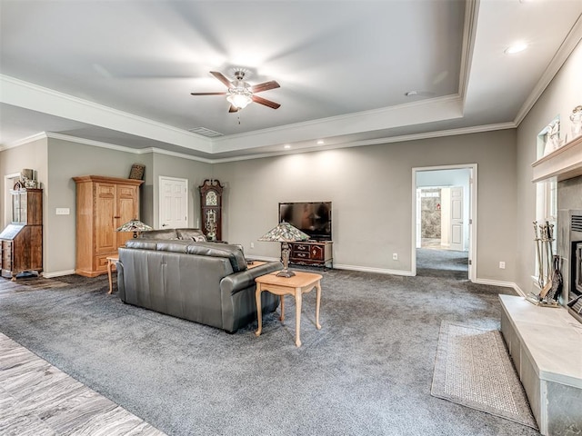 940908 S 3300th Rd, Luther, OK 73054 - living area with a raised ceiling, ceiling fan, crown molding, a fireplace, and recessed lighting