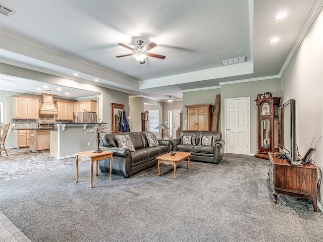 940908 S 3300th Rd, Luther, OK 73054 - living room featuring light colored carpet, a raised ceiling, ornamental molding, ceiling fan, and recessed lighting