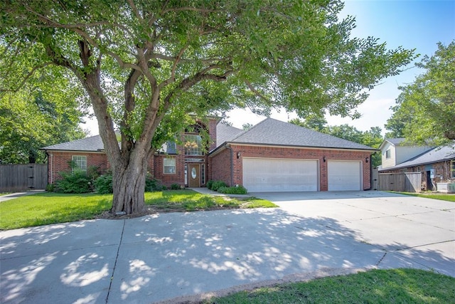 view of front of home with driveway, brick siding, and a garage