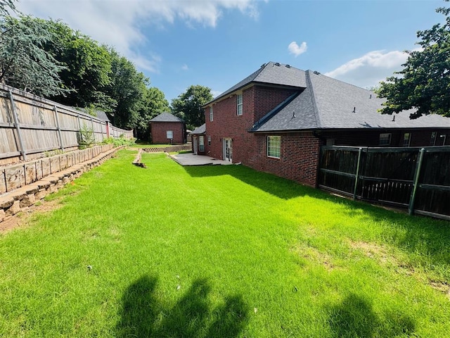 fenced backyard featuring a patio area