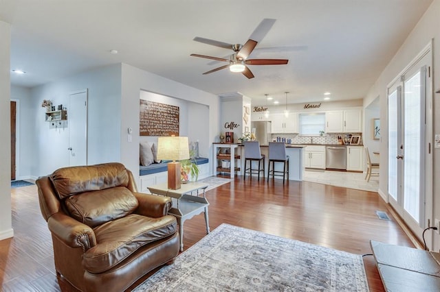 4813 NW 65th St, Oklahoma City, OK 73132 - living area featuring ceiling fan, light wood-style flooring, and recessed lighting