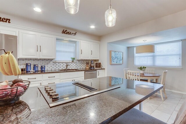 4813 NW 65th St, Oklahoma City, OK 73132 - kitchen featuring appliances with stainless steel finishes, decorative light fixtures, tasteful backsplash, white cabinets, and recessed lighting