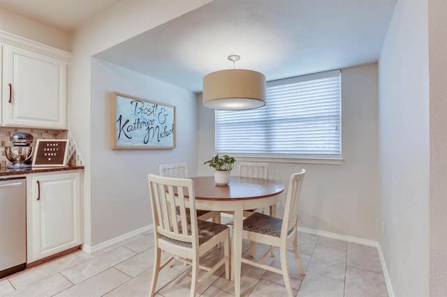 4813 NW 65th St, Oklahoma City, OK 73132 - dining space featuring light tile patterned flooring and baseboards