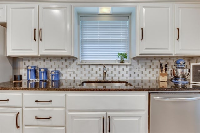 4813 NW 65th St, Oklahoma City, OK 73132 - kitchen featuring dishwasher, white cabinetry, tasteful backsplash, and dark stone counters