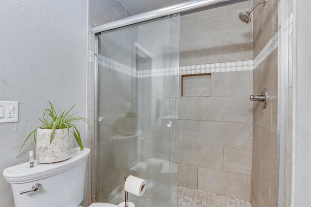 4813 NW 65th St, Oklahoma City, OK 73132 - bathroom with a stall shower and a textured wall