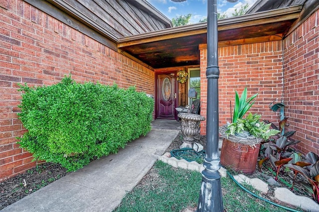 1108 S 13th St, Clinton, OK 73601 - view of exterior entry featuring brick siding
