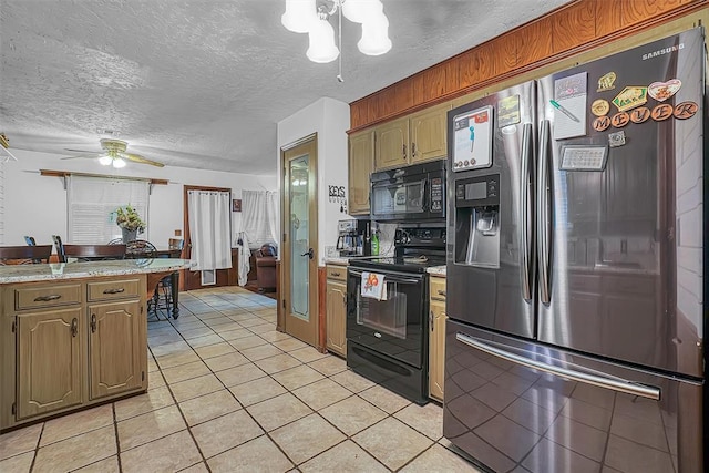 1108 S 13th St, Clinton, OK 73601 - kitchen with black appliances, light countertops, light tile patterned flooring, a chandelier, and a textured ceiling