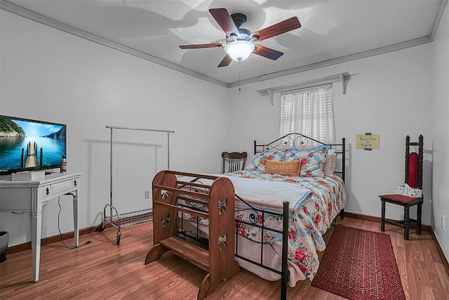 1108 S 13th St, Clinton, OK 73601 - bedroom featuring wood finished floors, ceiling fan, and crown molding