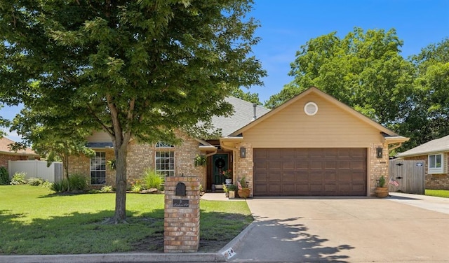 5 Larkens Pl, Shawnee, OK 74801 - view of front of house with an attached garage, concrete driveway, and brick siding