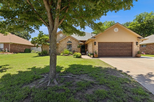 5 Larkens Pl, Shawnee, OK 74801 - view of front of property featuring an attached garage, driveway, brick siding, and a front lawn