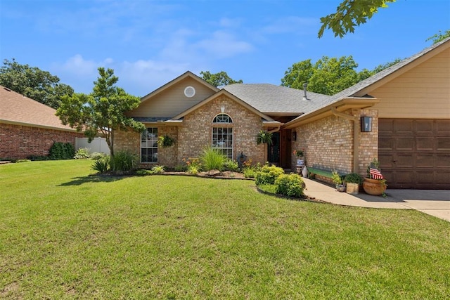5 Larkens Pl, Shawnee, OK 74801 - view of front facade with brick siding, a front yard, an attached garage, and a shingled roof