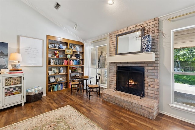 5 Larkens Pl, Shawnee, OK 74801 - sitting room featuring lofted ceiling, wood finished floors, crown molding, a fireplace, and built in features
