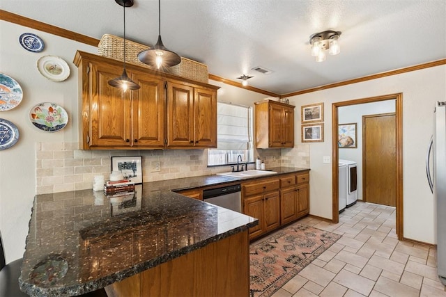 5 Larkens Pl, Shawnee, OK 74801 - kitchen with appliances with stainless steel finishes, backsplash, brown cabinetry, and crown molding