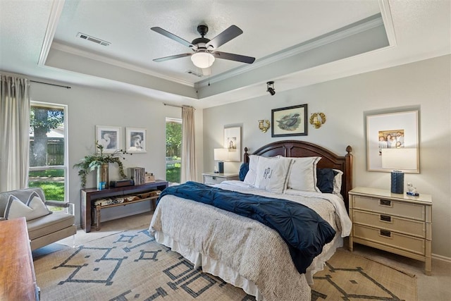5 Larkens Pl, Shawnee, OK 74801 - bedroom with a raised ceiling, ornamental molding, light colored carpet, and a ceiling fan