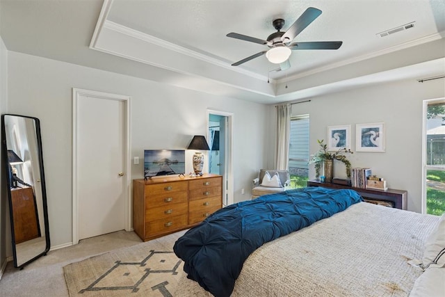 5 Larkens Pl, Shawnee, OK 74801 - carpeted bedroom featuring ornamental molding, a tray ceiling, and a ceiling fan