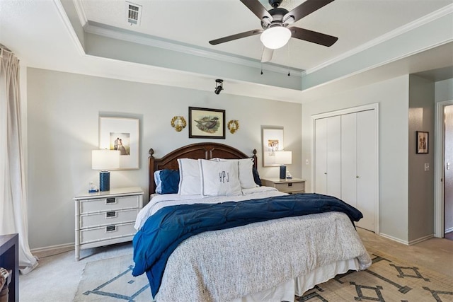 5 Larkens Pl, Shawnee, OK 74801 - bedroom with light carpet, crown molding, a closet, ceiling fan, and a tray ceiling