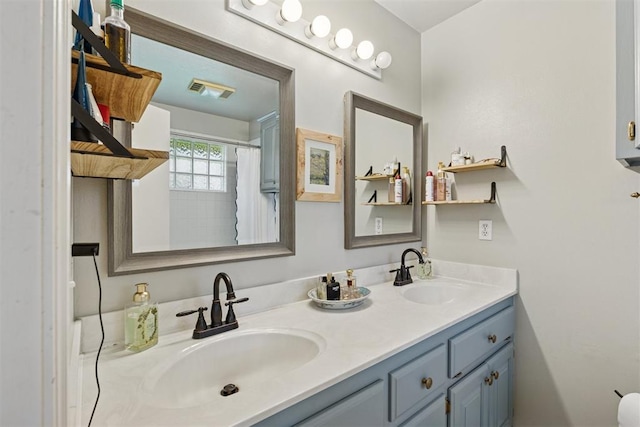 5 Larkens Pl, Shawnee, OK 74801 - bathroom featuring double vanity and curtained shower