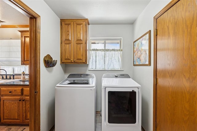 5 Larkens Pl, Shawnee, OK 74801 - laundry area featuring washer and clothes dryer and cabinet space