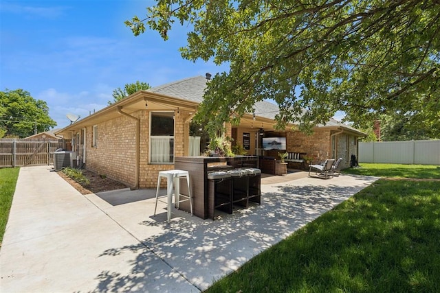 5 Larkens Pl, Shawnee, OK 74801 - rear view of house with a patio area, brick siding, and a fenced backyard