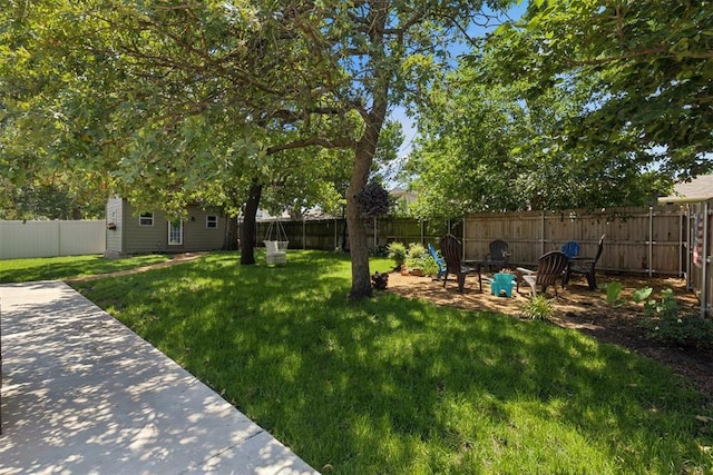 5 Larkens Pl, Shawnee, OK 74801 - fenced backyard with an outbuilding and a patio area