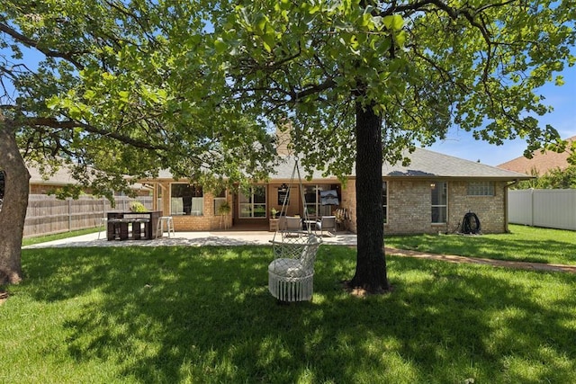 5 Larkens Pl, Shawnee, OK 74801 - rear view of house featuring a patio and brick siding