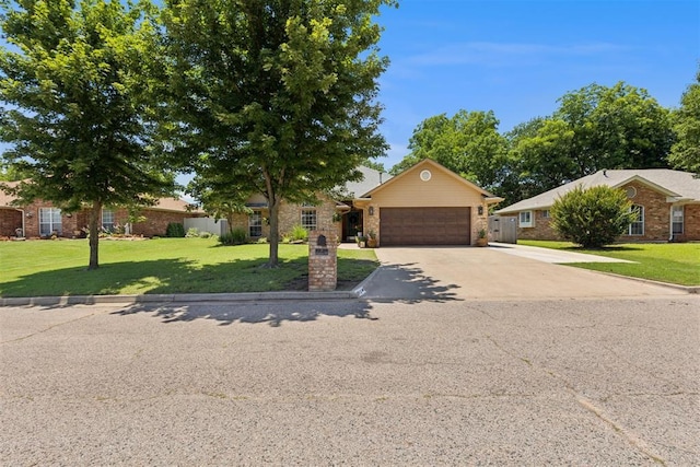 5 Larkens Pl, Shawnee, OK 74801 - view of front of house featuring driveway, a garage, brick siding, and a front yard