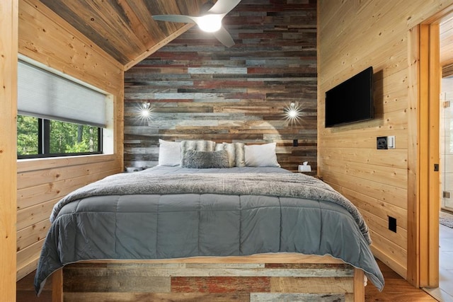 173 Guppy Ln, Hochatown, OK 74728 - bedroom featuring wooden walls, lofted ceiling, wood ceiling, and wood finished floors