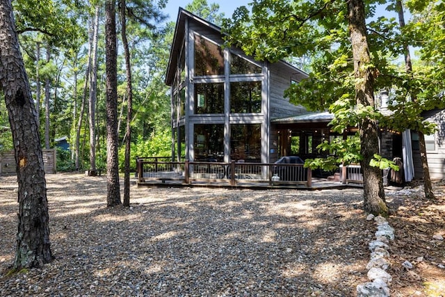 173 Guppy Ln, Hochatown, OK 74728 - back of property with a wooden deck and a metal roof