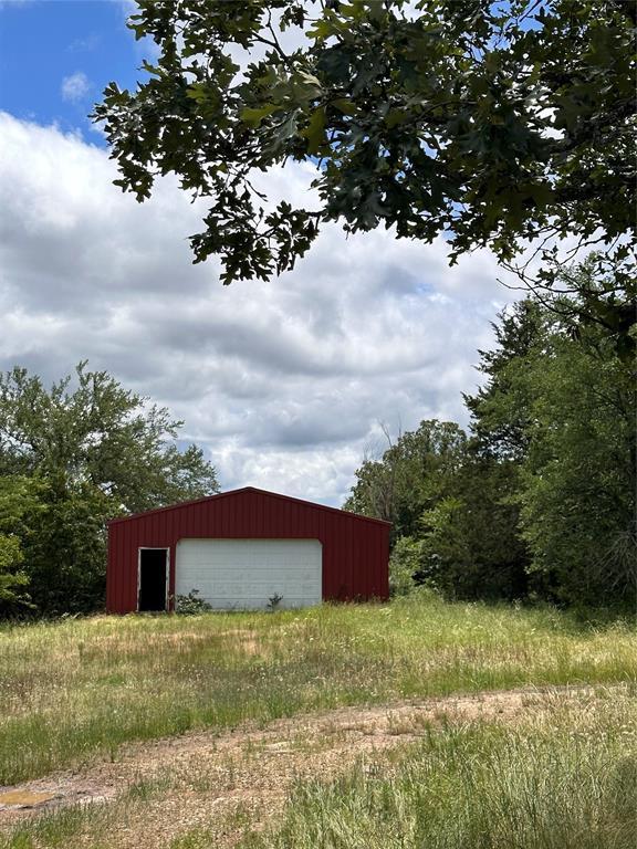 182424 N 4159th Rd, Moyers, OK 74557 - view of yard with a garage and an outdoor structure