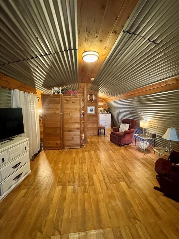 182424 N 4159th Rd, Moyers, OK 74557 - living area with hardwood / wood-style flooring, vaulted ceiling, and wooden walls