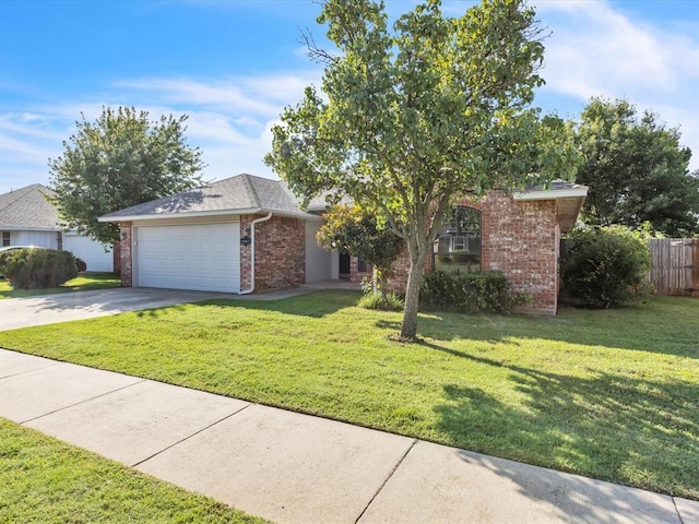 4001 Tori Pl, Yukon, OK 73099 - view of property hidden behind natural elements featuring brick siding, a garage, and concrete driveway
