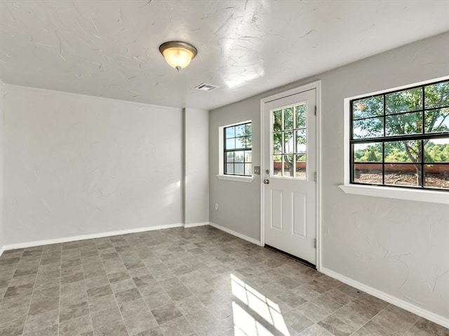 4001 Tori Pl, Yukon, OK 73099 - doorway to outside with baseboards