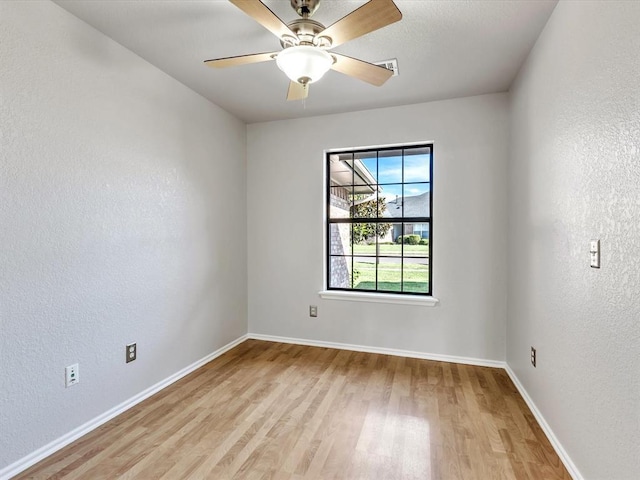 4001 Tori Pl, Yukon, OK 73099 - spare room featuring light wood-style floors and a textured wall