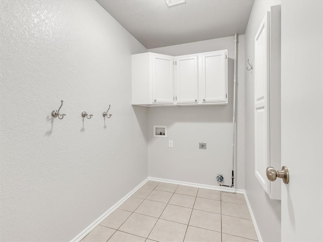 4001 Tori Pl, Yukon, OK 73099 - laundry area with light tile patterned floors, hookup for a washing machine, electric dryer hookup, and cabinet space