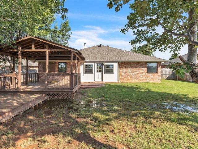 4001 Tori Pl, Yukon, OK 73099 - rear view of house featuring a gazebo, brick siding, a shingled roof, and a deck