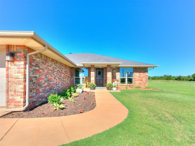 5053 Northridge Run, Cashion, OK 73016 - view of front facade featuring a front yard, brick siding, and roof with shingles