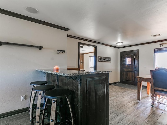 5053 Northridge Run, Cashion, OK 73016 - bar featuring crown molding and wood finished floors