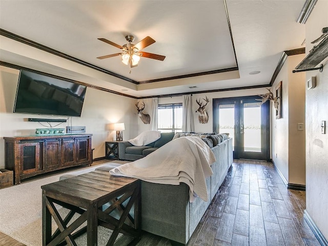 5053 Northridge Run, Cashion, OK 73016 - living room with crown molding, a raised ceiling, a ceiling fan, and wood finished floors