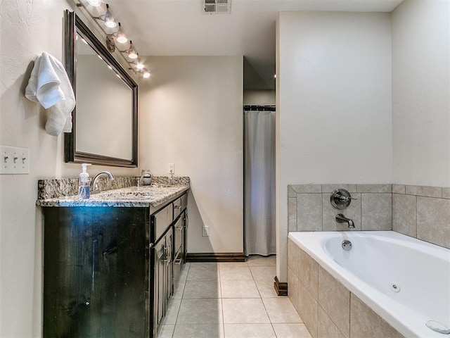 5053 Northridge Run, Cashion, OK 73016 - bathroom featuring a whirlpool tub, vanity, and tile patterned flooring