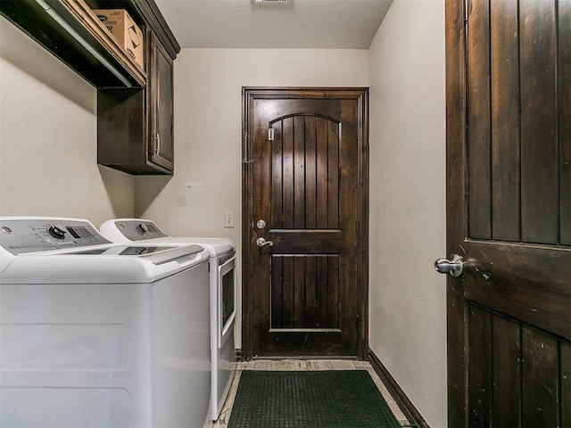 5053 Northridge Run, Cashion, OK 73016 - washroom with separate washer and dryer, cabinet space, and tile patterned floors
