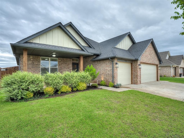 11716 SW 47th St, Mustang, OK 73064 - view of front of home featuring board and batten siding, brick siding, an attached garage, and driveway