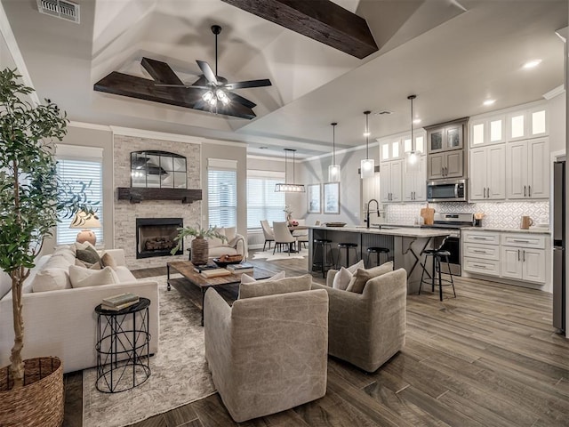 11716 SW 47th St, Mustang, OK 73064 - living area featuring dark wood-type flooring, ceiling fan, a stone fireplace, and recessed lighting