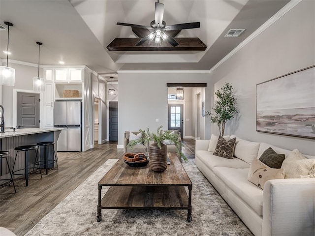 11716 SW 47th St, Mustang, OK 73064 - living room with light wood-style floors, ornamental molding, and ceiling fan