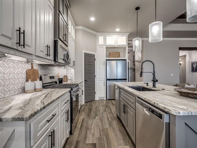 11716 SW 47th St, Mustang, OK 73064 - kitchen with appliances with stainless steel finishes, open shelves, glass insert cabinets, recessed lighting, and a center island with sink